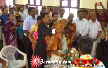 Vibin Leena Marriage snap Manthrakodi Wedding dress